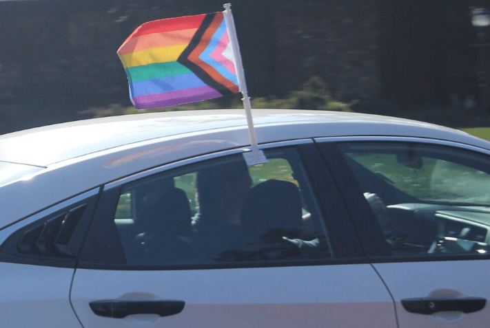 Car with rainbow flag